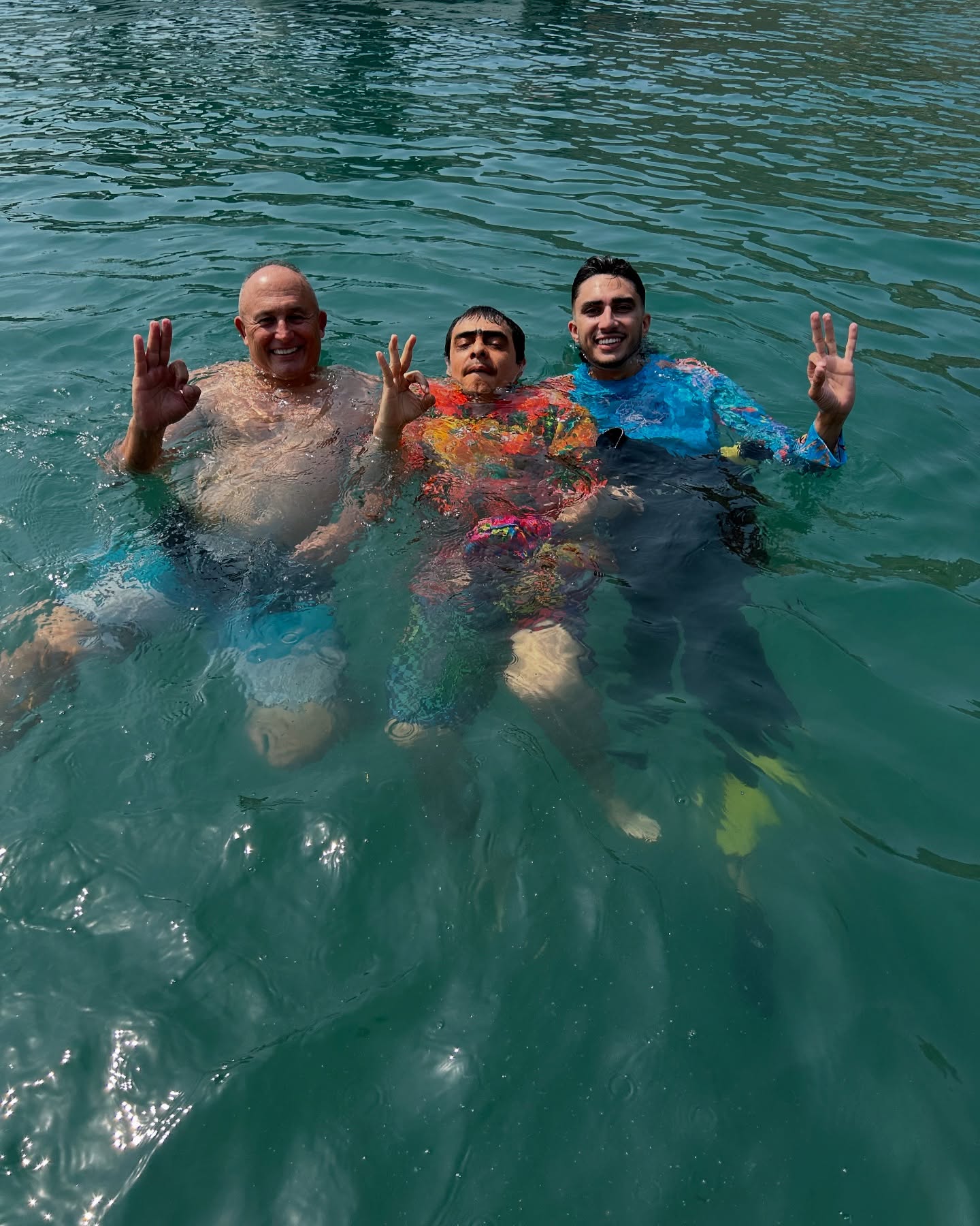 Tourists enjoying Aquatrek underwater walking in crystal-clear waters of Santa Marta